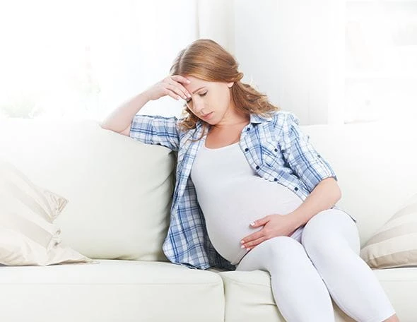 Pregnant woman in discomfort